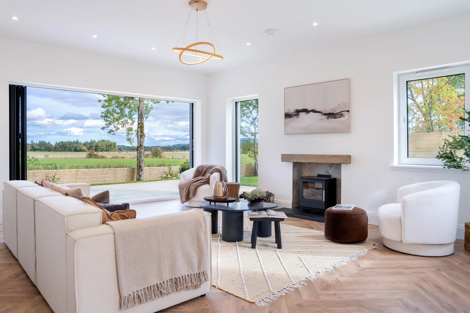A light-filled living room with views across the countryside